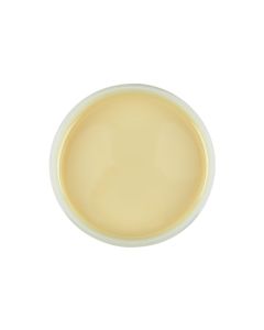 Top view of an open container of Satin Smooth beBare Hair Removal System Soy Wax featuring its creamy beige color