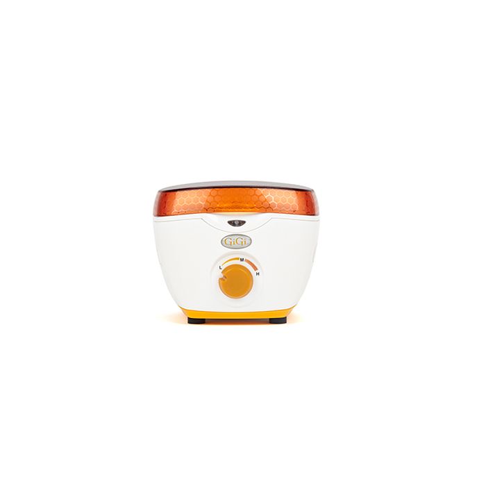 Front view of GiGi Mini Honee Wax Warmer featuring its orange lid, markings, LED indicator light, & temperature control knob Front view of GiGi Mini Honee Wax Warmer featuring its orange lid, markings, LED indicator light, & temperature control knob